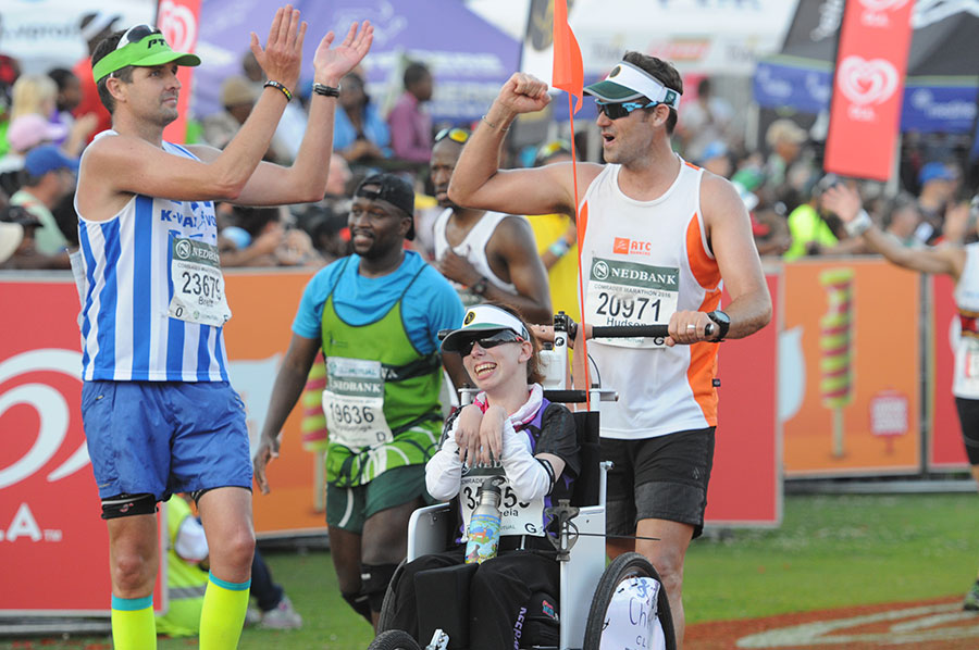 Mycroft at the finish line of the Comrades Marathon in South Africa - the first wheelchair participant in the marathon's 95-year history.