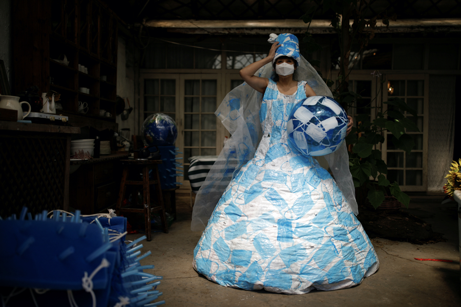 Chinese Artist Creates Wedding Dress Made From Masks to Show Hope